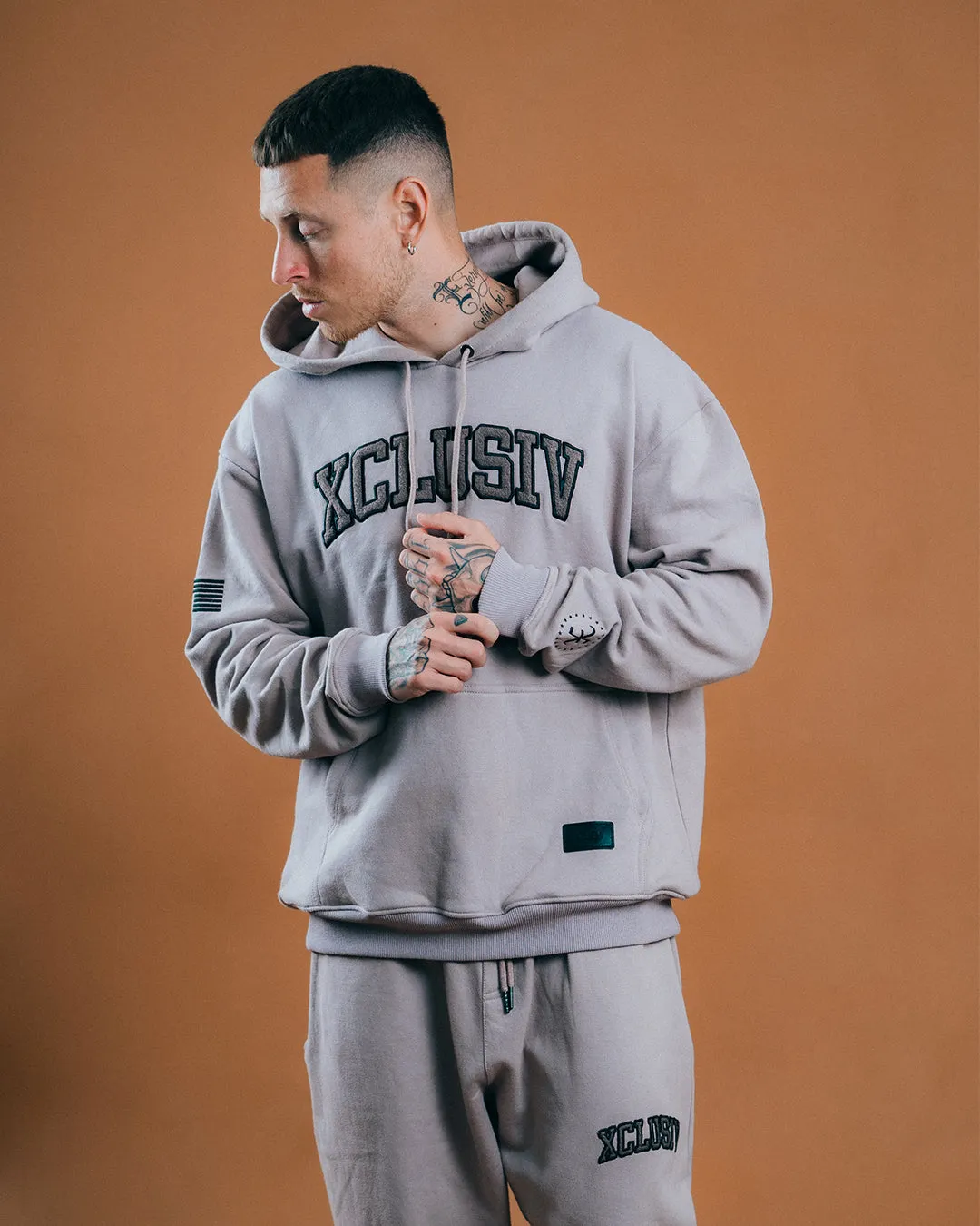 XCLUSIV CEMENT VARSITY SWEATSHIRT