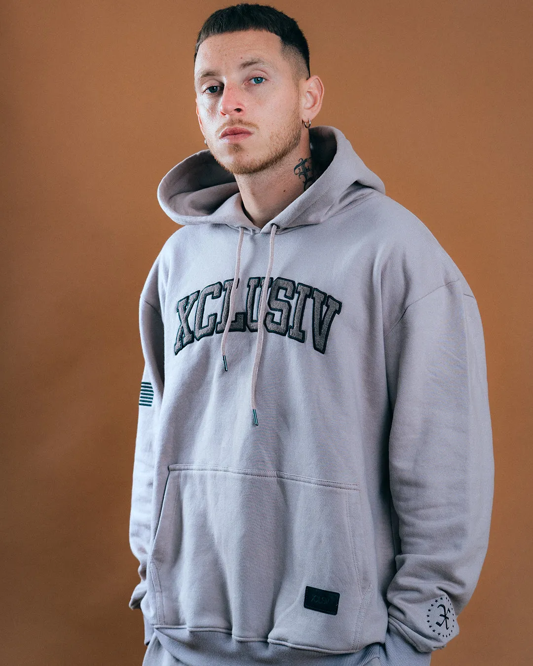 XCLUSIV CEMENT VARSITY SWEATSHIRT