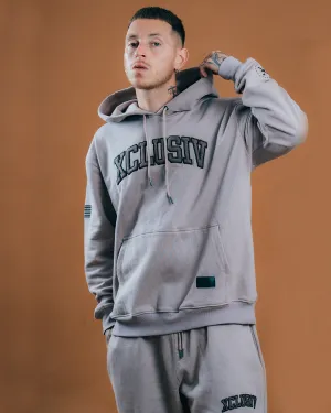 XCLUSIV CEMENT VARSITY SWEATSHIRT